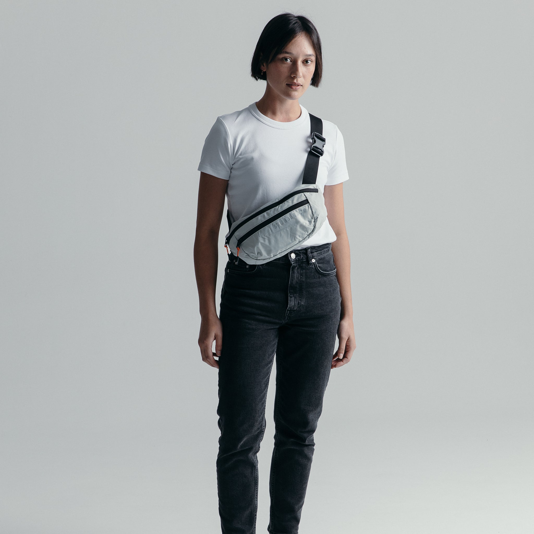 Female wearing the Off-White packable Ultra Light Crossbody Bag