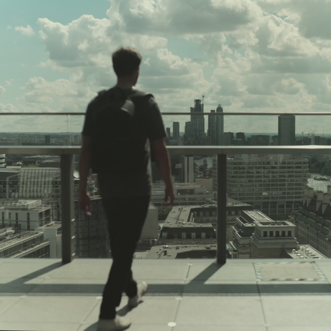 Man using The Commuter Backpack All Black or Black and Gold