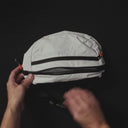 How to pack and fold the Ultra Light Sling packable, which comes in Off-White and All Black